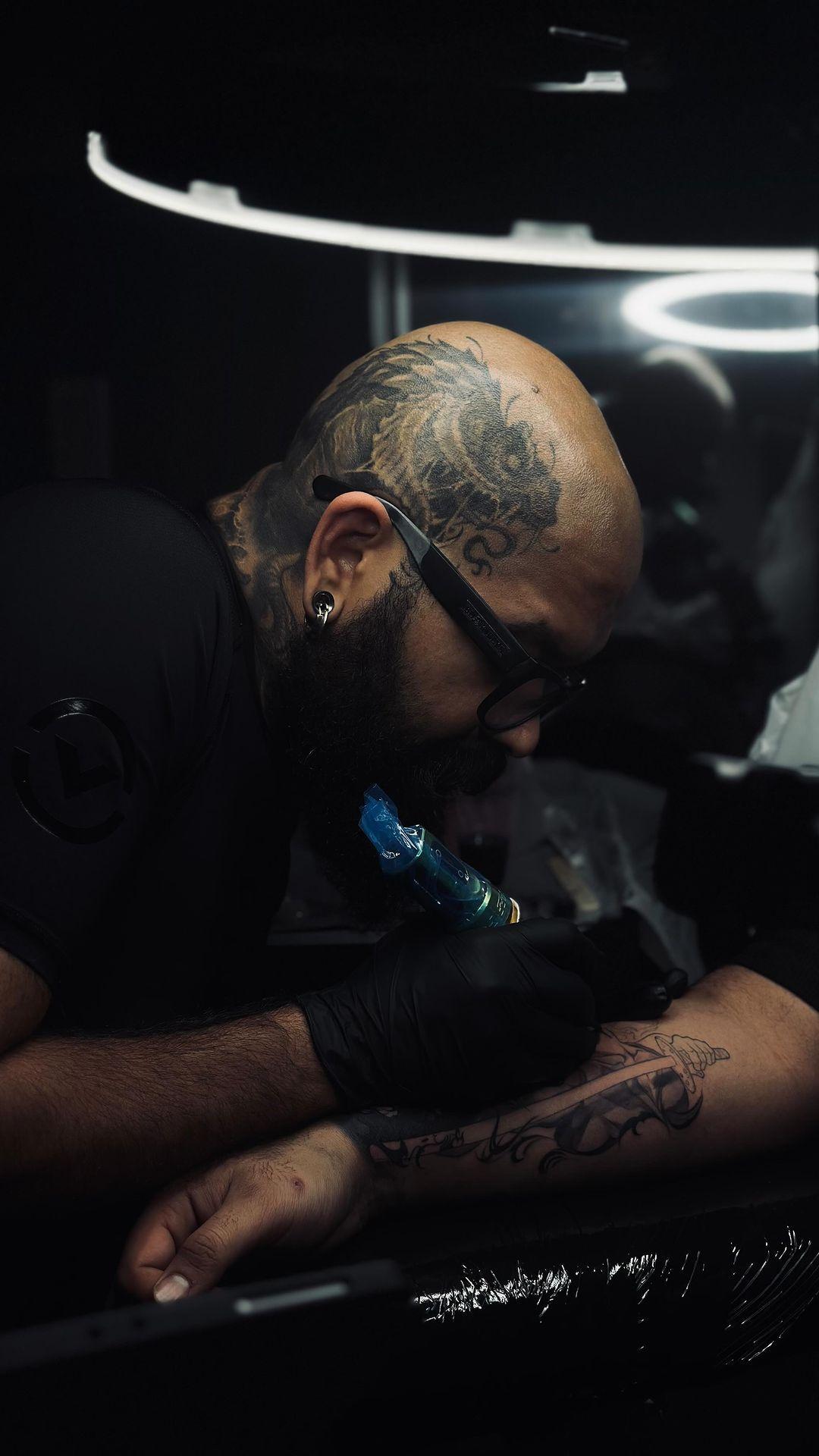 Welcome to Adi Tattoos, one of the top-rated tattoo studios in the Greater Toronto Area (GTA) and Niagara region. Adi, a master tattoo artist with over 14 years of experience, is known for his exceptional black and grey realism, custom designs, and hyper-realistic portrait tattoos. Whether you’re in Toronto, Mississauga, Hamilton, or Niagara Falls, Adi’s studio is the go-to destination for anyone looking for high-quality, unique tattoos. From intricate sleeves to lifelike portrait pieces, Adi's expertise and attention to detail make him a sought-after artist in the GTA and beyond. Book your consultation today and bring your tattoo vision to life.